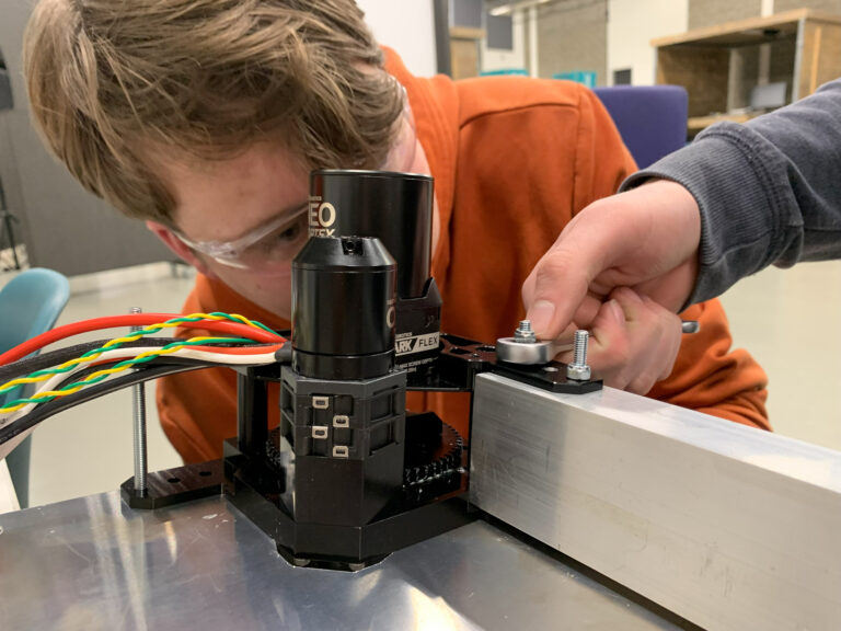 The swerve modules are fastened to the drivetrain