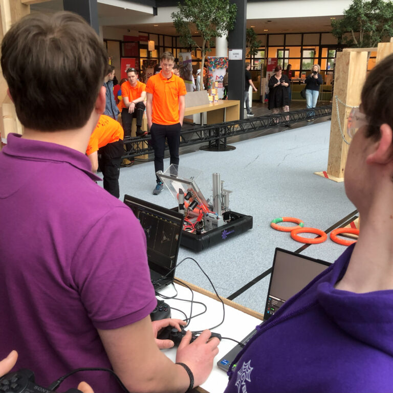 Finn and Ramon are controlling the robot on the field