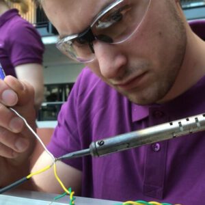 Thomas soldering cables together